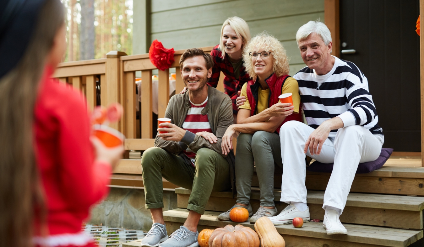 grandparents and parents admiring granddaughters halloween costume