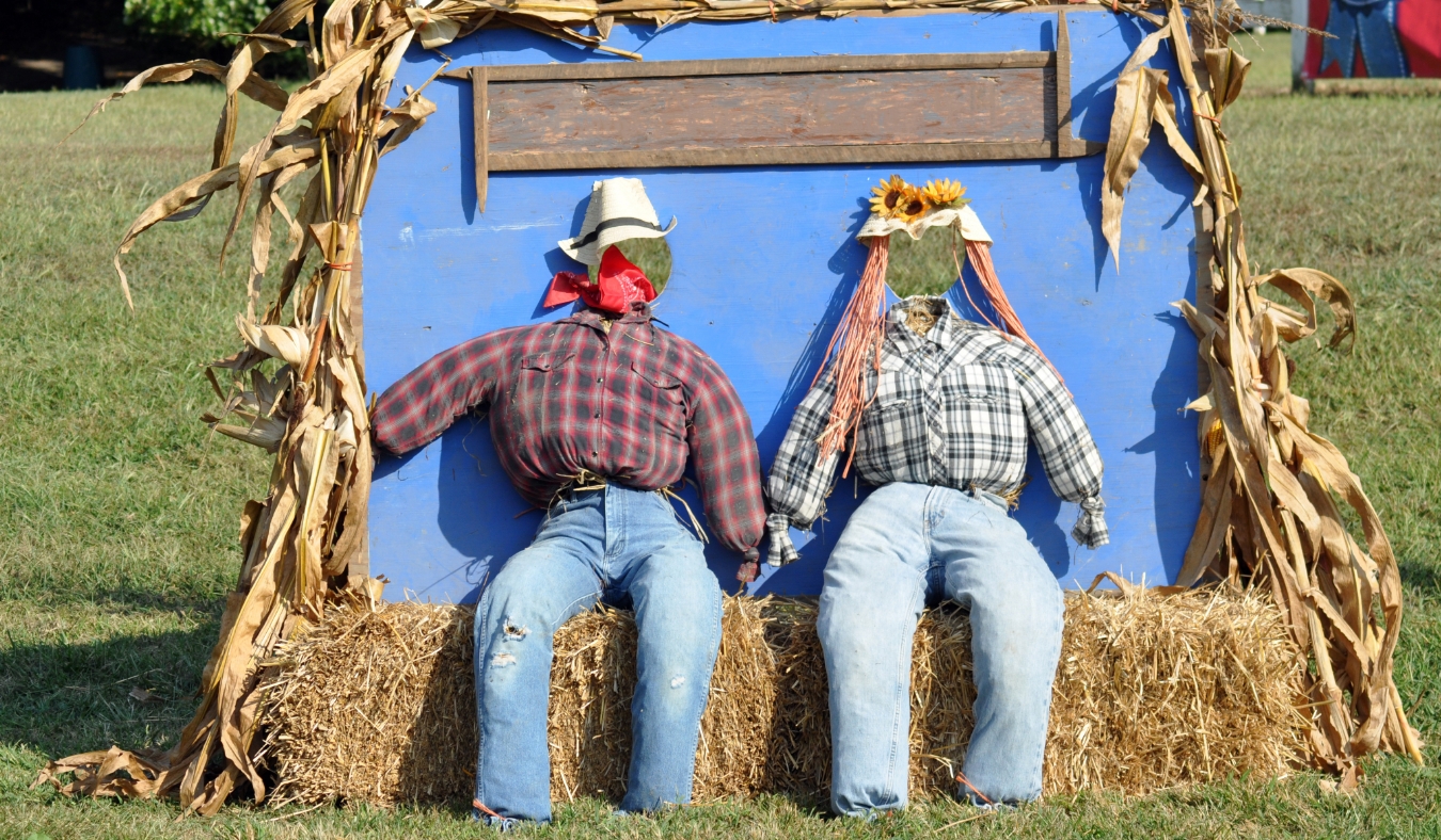 straw stuffed forms wearing flannel shirts jeans and hats