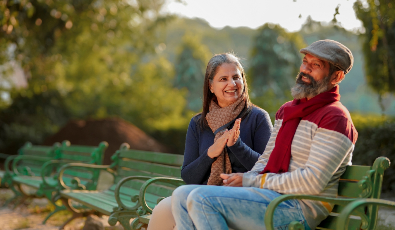 couple in warm clothes in winter at park