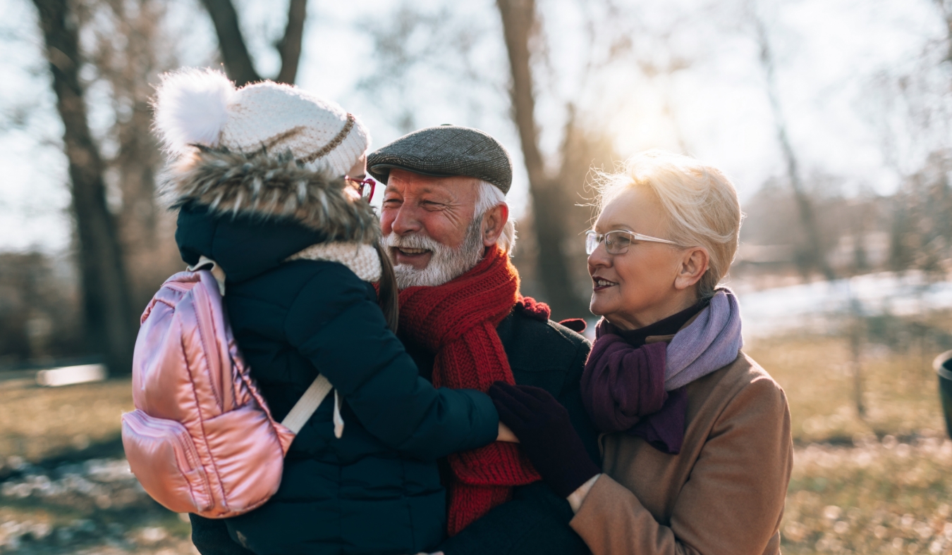 diverse senior friends laughing drinking coffee during autumn weather