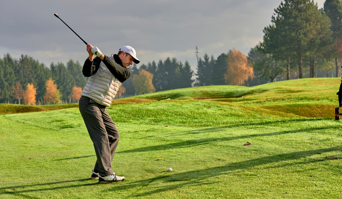 golfer on a golf course in winter
