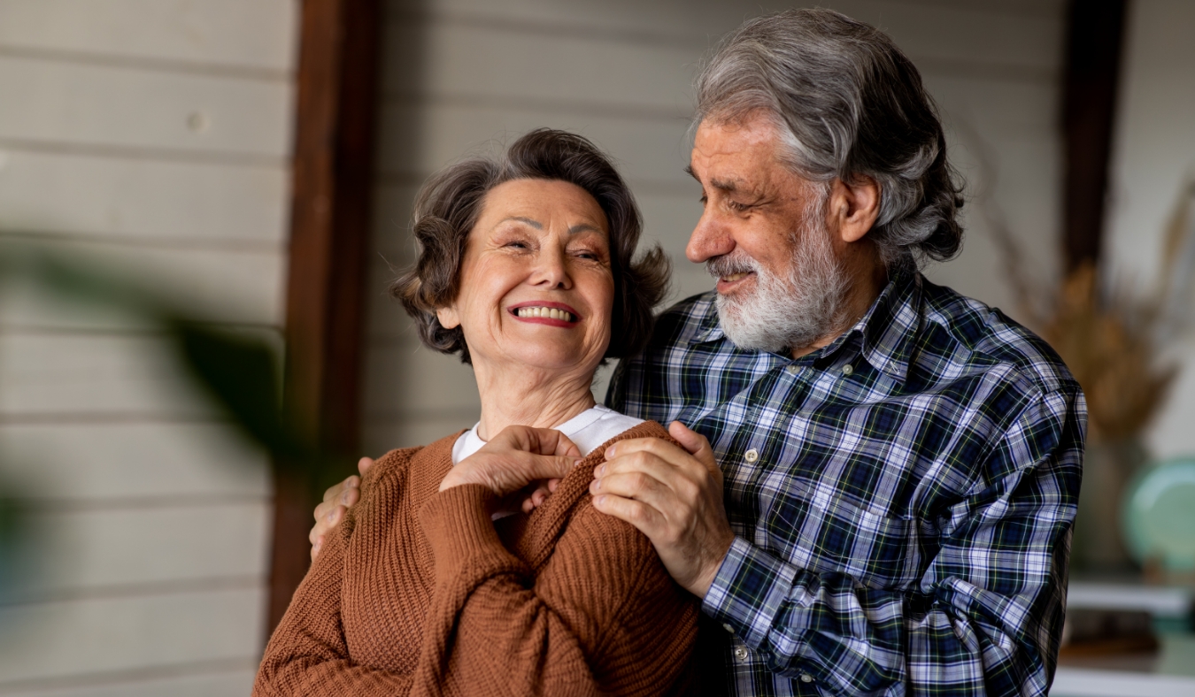 senior couple embracing enjoying colder months