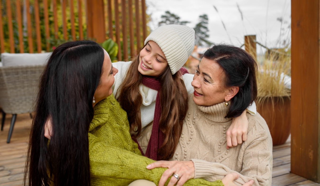 three generations women hugging