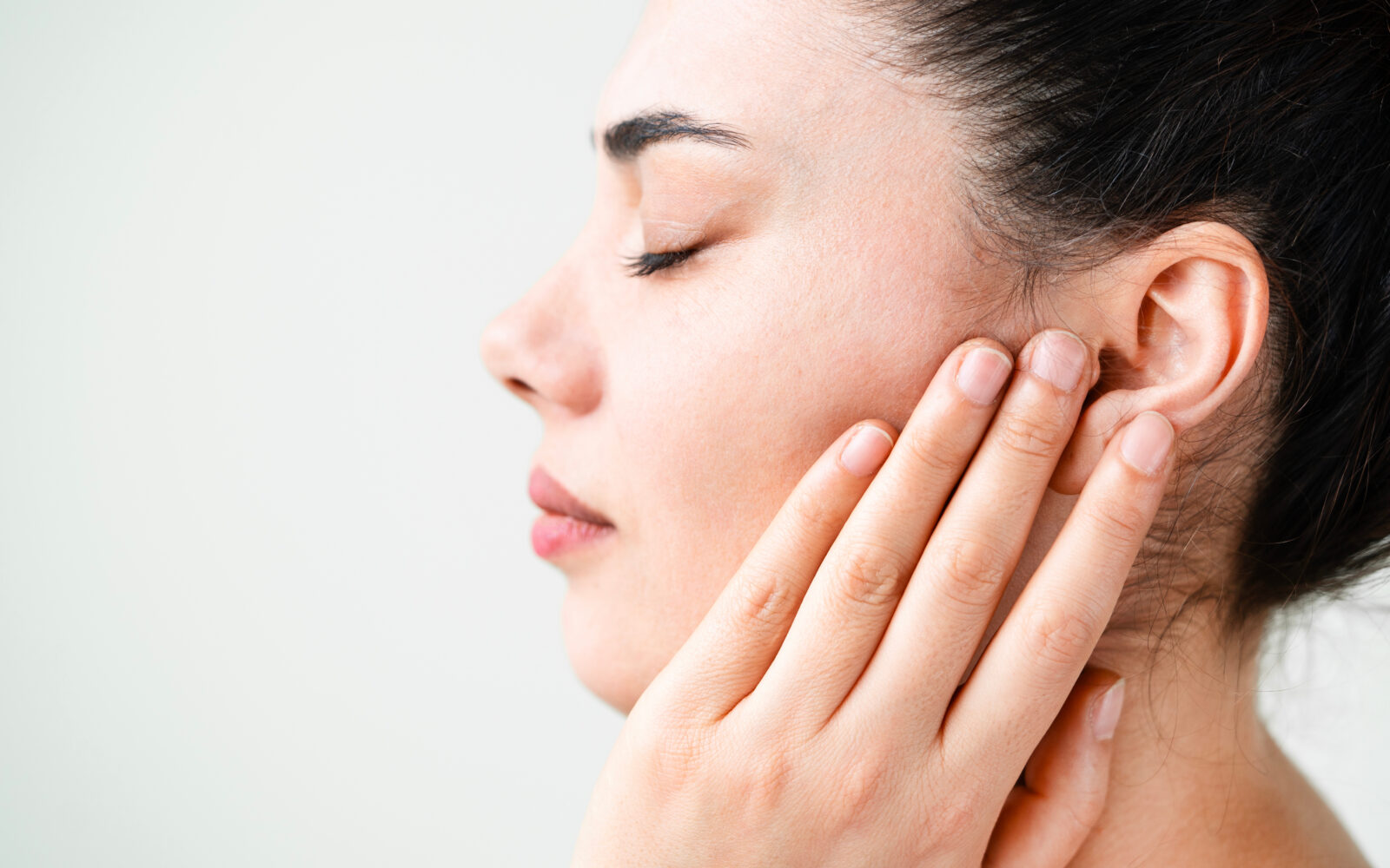 Young woman suffering from pain