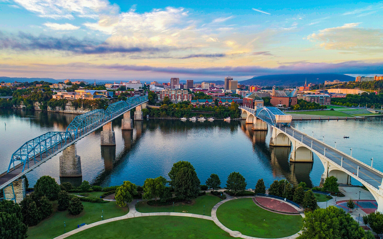 Scenic photo of Chattanooga with the river, bridges, and buildings showing