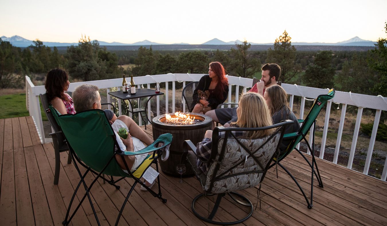 friend group around fire pit