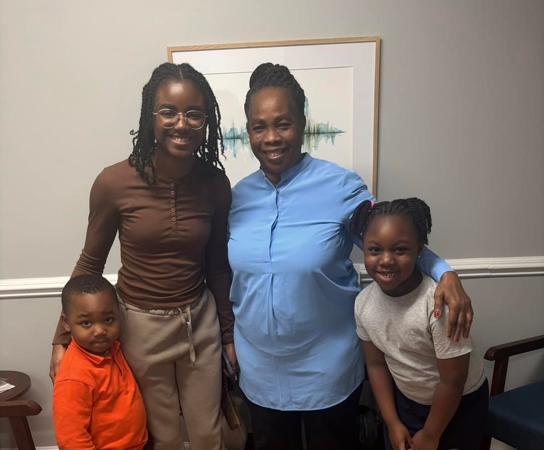 Ms Helen her grandchildren and the family friend who nominated her for the Gift of Hearing event cropped