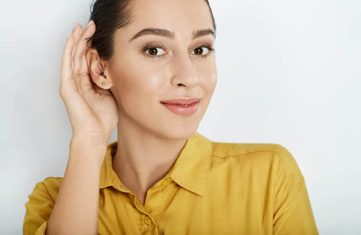 woman hand to ear