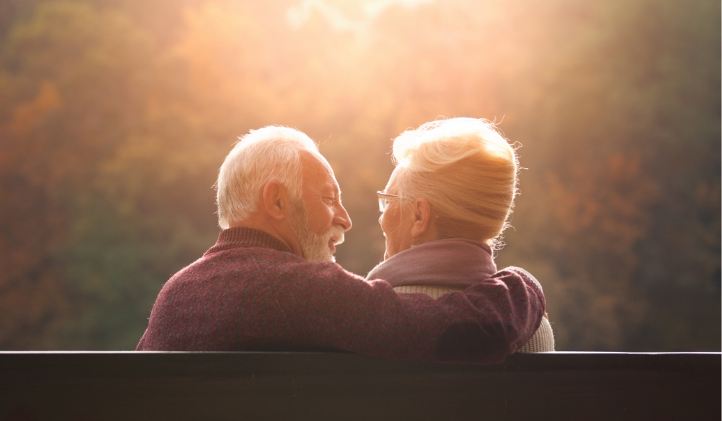 fall couple on bench